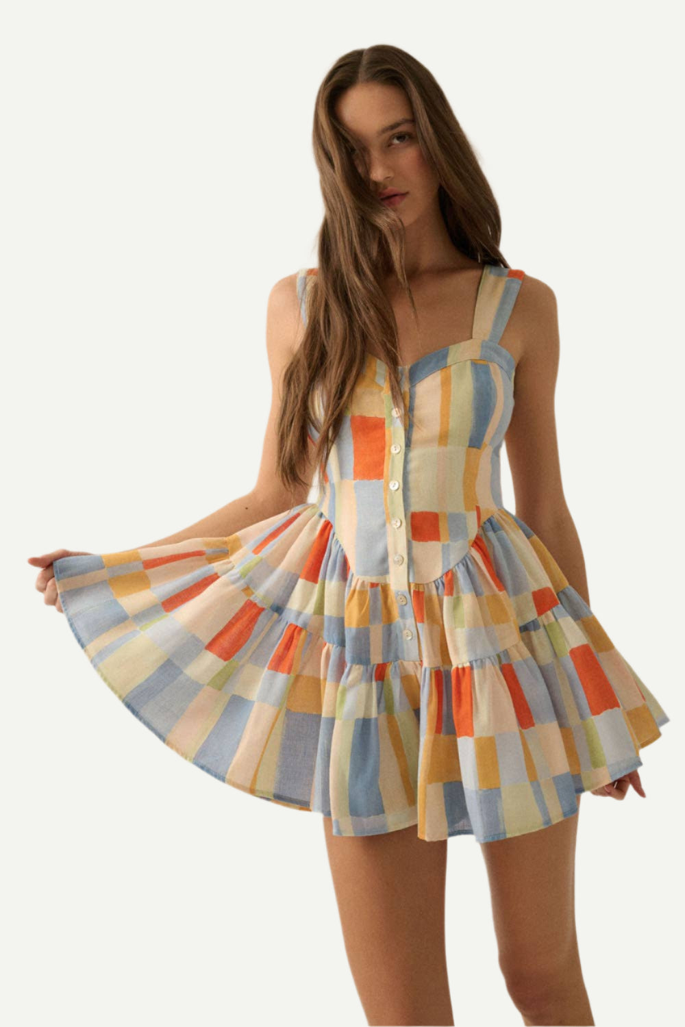 Main image of Blue Butter Romper Dress. Model holds to the side.