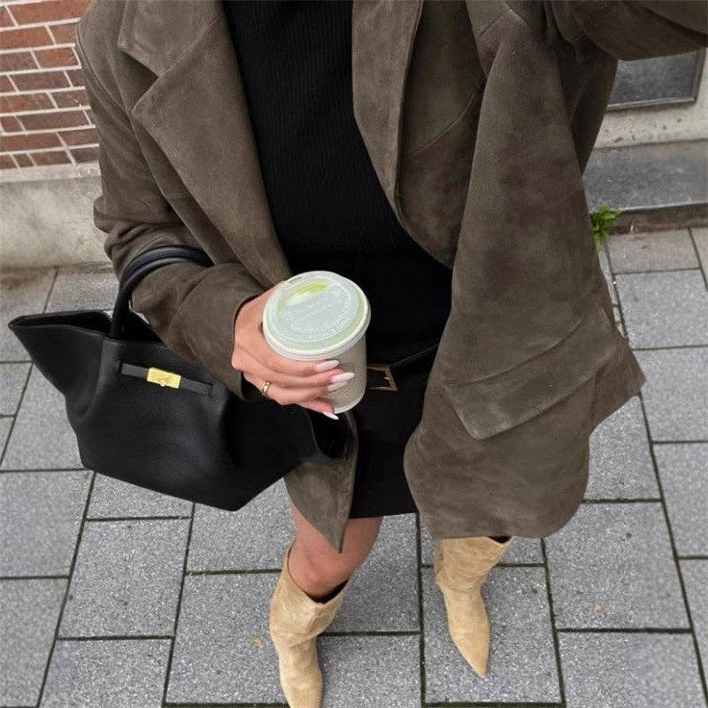 Close up of Vintage Suede Short Jacket Coat in Brown. Model holds coffee cup.
