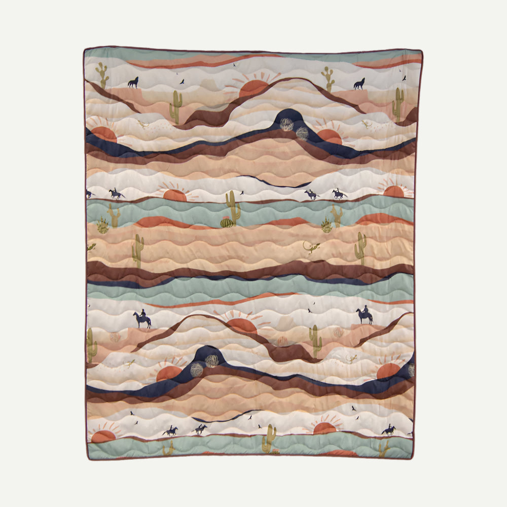 Earth-toned woven throw with cowboy, cactus and sun design.