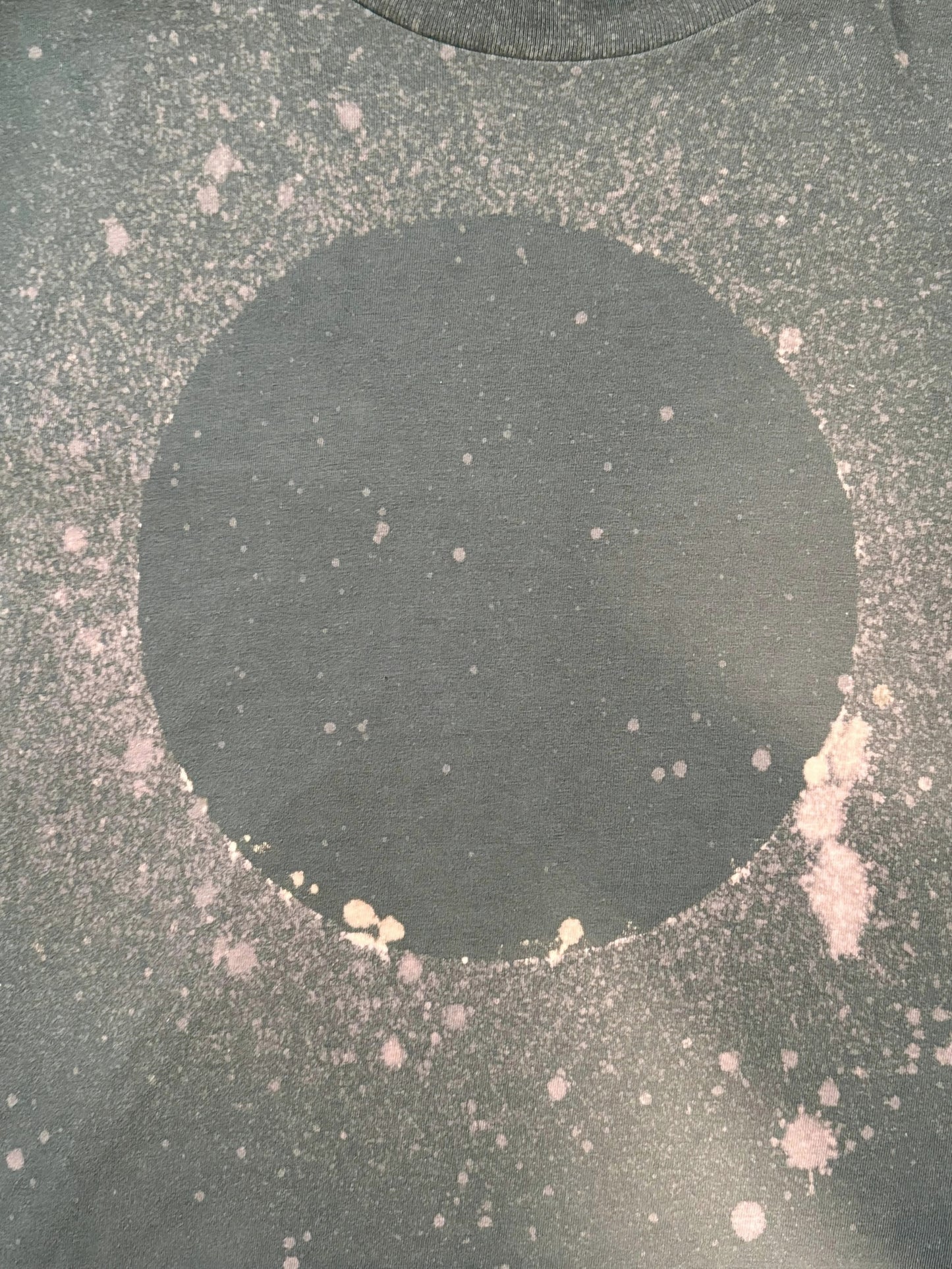 Close up of Luminary Organic Tee by Mira Blackman in Slate and showing circle graphic