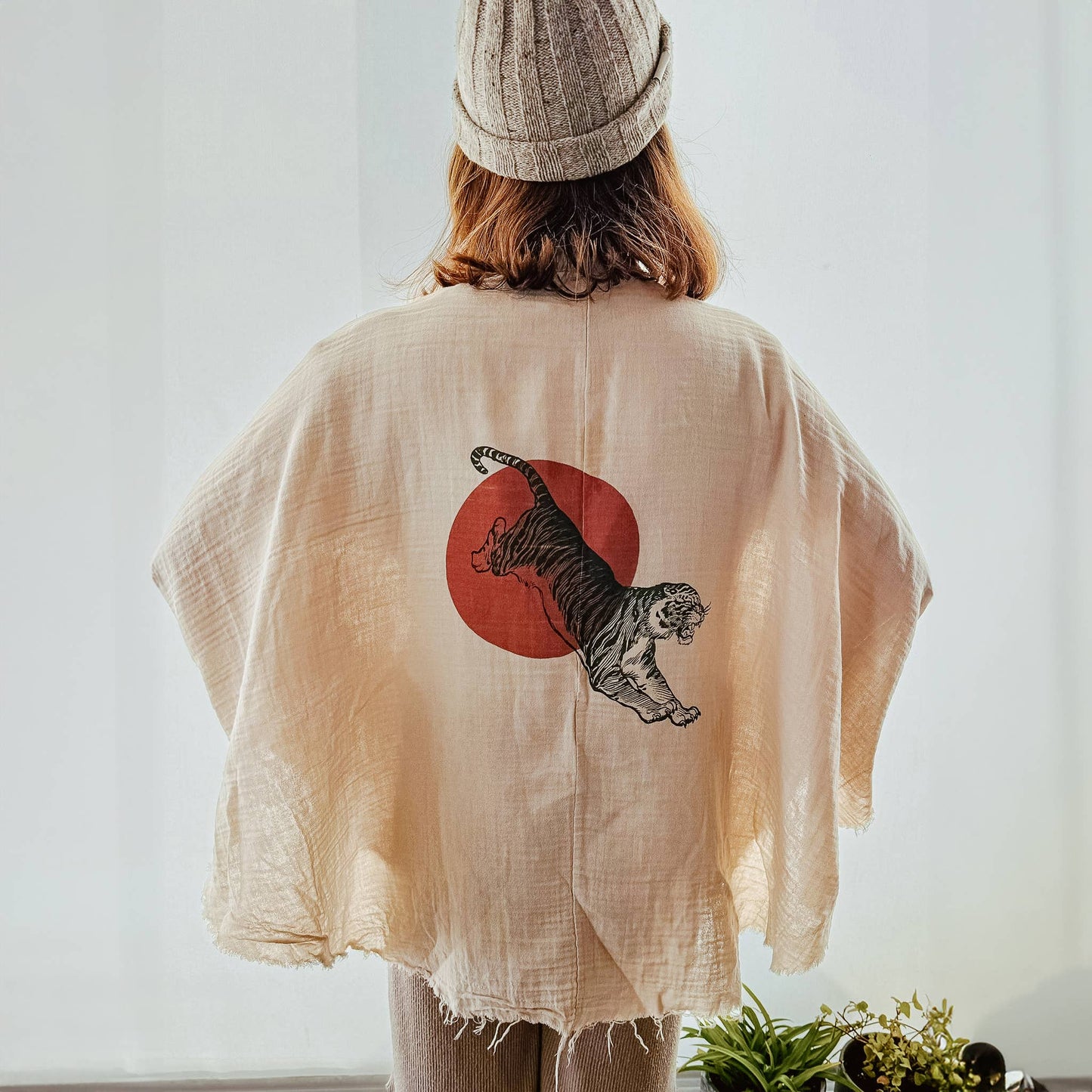 Lightweight white muslin kimono robe with a relaxed drape and, tiger in sun graphic on back.