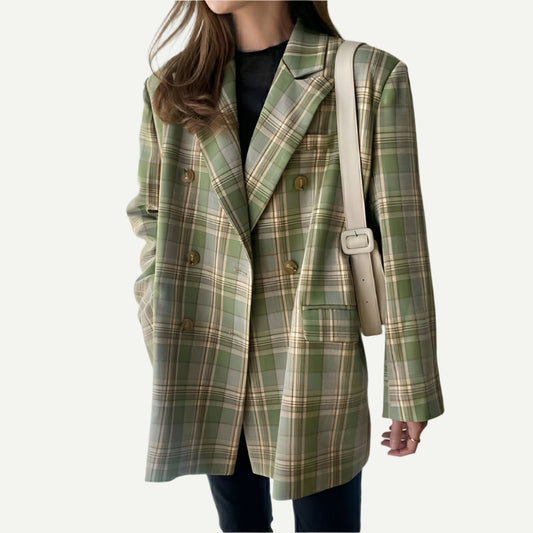 Oversized green tartan blazer  with soft tailoring, styled over black T-shirt and Jeans.