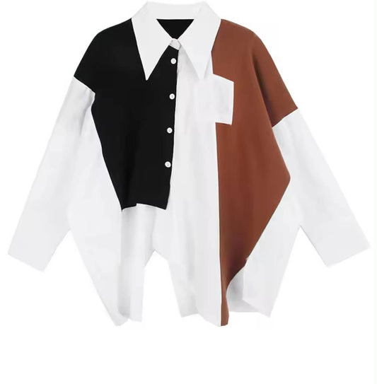 Long-sleeve shirt with asymmetrical hem and bold black and rust color-block panels in a modern silhouette.