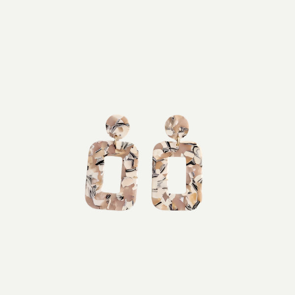North and Five Handmade Sandstone Earrings on neutral background. 