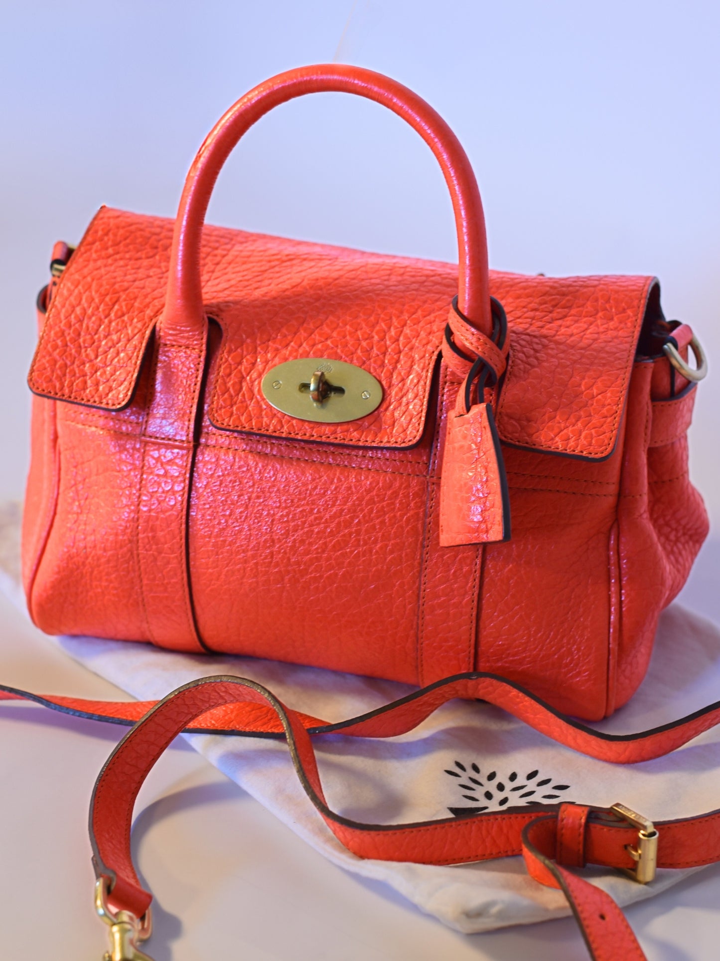 Coral orange Mulberry Bayswater leather bag, shown with strap.
