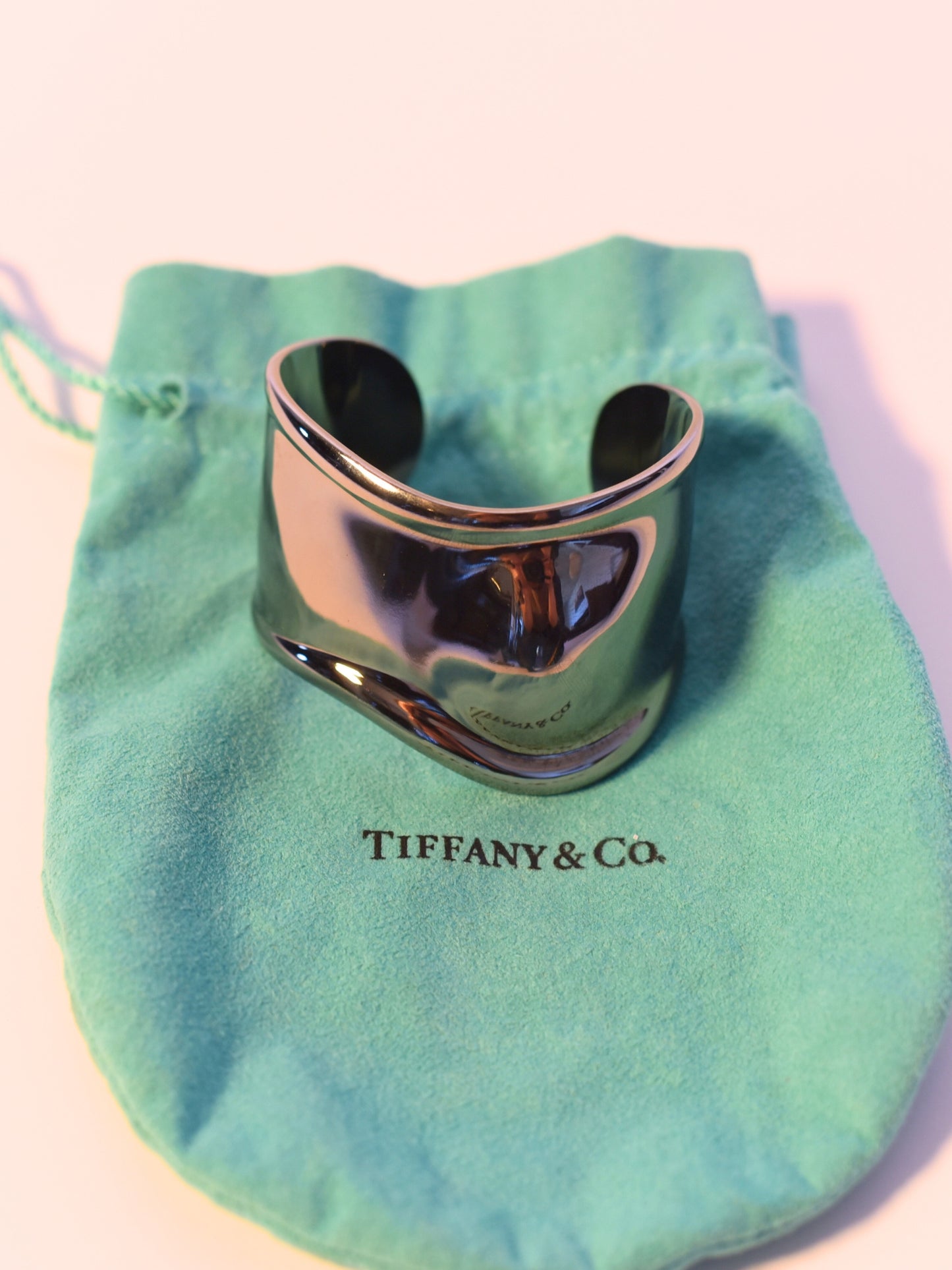 Sterling silver Tiffany Elsa Peretti Bone Cuff, with sculptural, asymmetrical shape and ergonomic fit—iconic and fluid in form.
